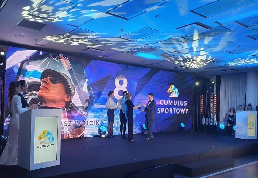 Grazyna giving Cumulus 2019 award to talented Łukasz Wójcik